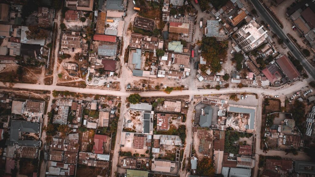 Drone shot of urban streets and buildings in Dar es Salaam, Tanzania.